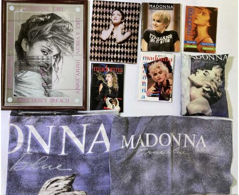 A framed Madonna mirror (49 x 64cm), programme inc cut-out mask, books, bedding, a printed pillow.