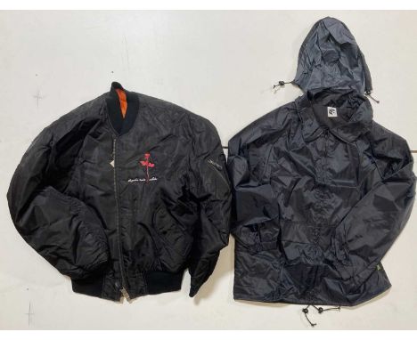 A Carhartt jacket issued in 1993 to promote 'Songs of Faih and Devotion' (no size label), a 'Mute' rain jacket (M), a 'Blouso