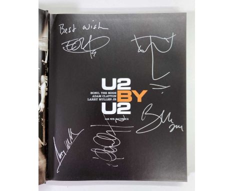 A copy of 'U2 by U2' signed to title page in silver ink by The Edge, Larry Mullen Jr,, Adam Clayton, Bono. Also with sketch /