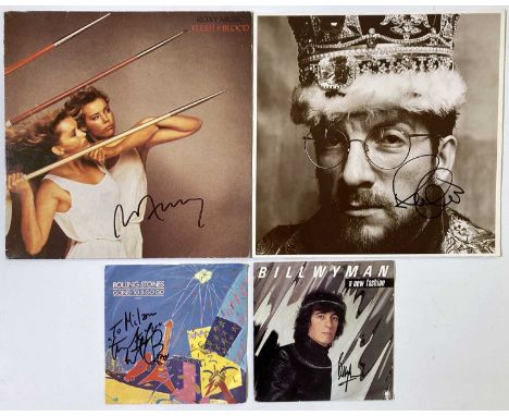 Signed records to include: 7" single signed by Bill Wyman, 7" single signed with inscription by Charlie Watts, an LP signed b