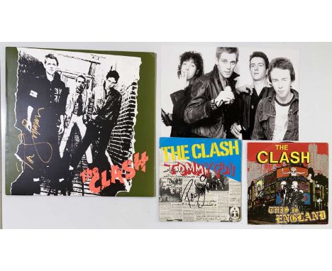 Two 7" singles , a glossy 12 x 8" photo, an LP (modern reissue) all bearing a signature by Paul Simonon of The Clash. Signatu