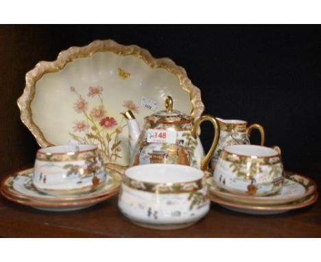 A Japanese Satsuma breakfast set, comprising sugar basin, creamer, two cups, two saucers, two side plates and a tea pot. Also