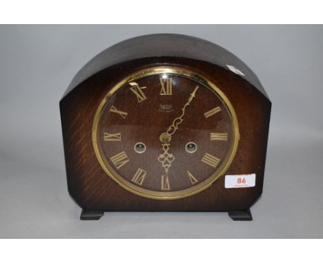 An early 20th century Smiths oak cased mantel clock.