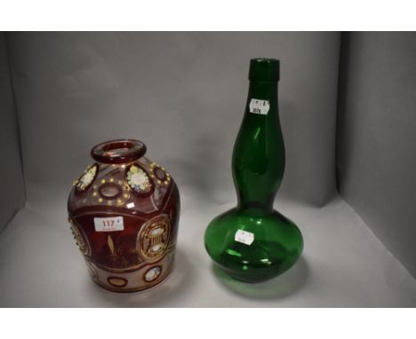 A Victorian ruby glass receptacle having gilt heightening and floral decoration and a green glass art glass vase or bottle.
