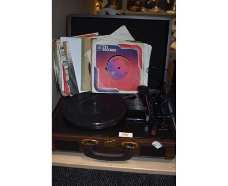 A modern USB Turntable record player with a selection of 75rpm singles.