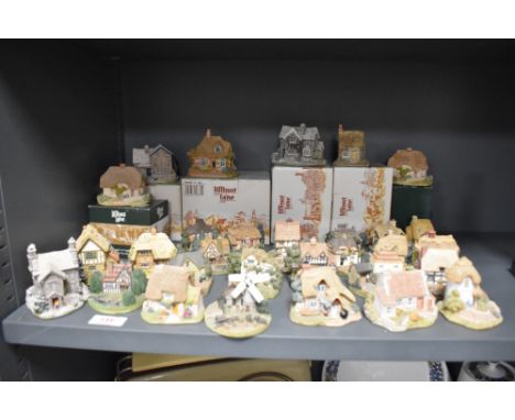 A selection of vintage Lilliput lane model houses and cottages, some having original boxes.