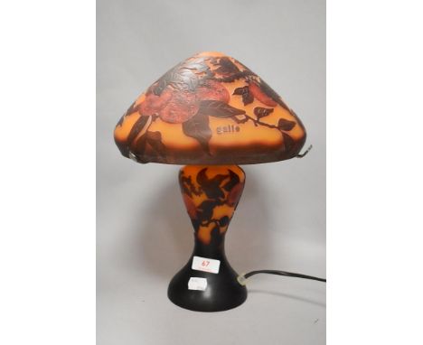 A modern orange and red glass mushroom form table lamp decorated with peaches. Bearing name Galle to shade.