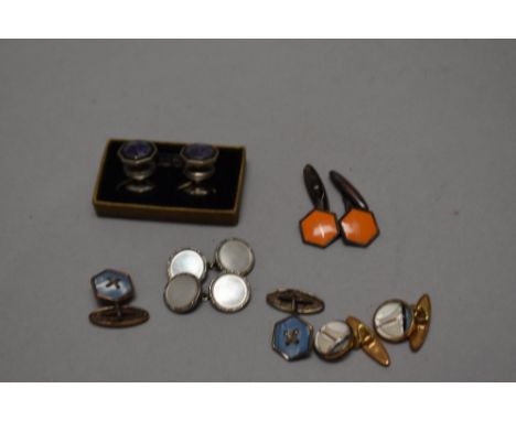 A pair of vintage yellow metal and glass maritime themed cuff-links, depicting yacht, sold together with four other pairs of 