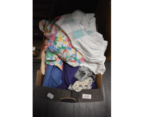 A box of ladies vintage and retro clothing, including bright 1980s blouse.