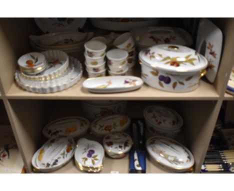 Two shelves of modern Royal Worcester Evesham pattern tea and dinner wares.