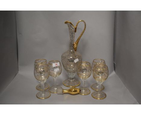 A vintage Bohemian glass jug and glasses set of six with a floral gilt pattern.