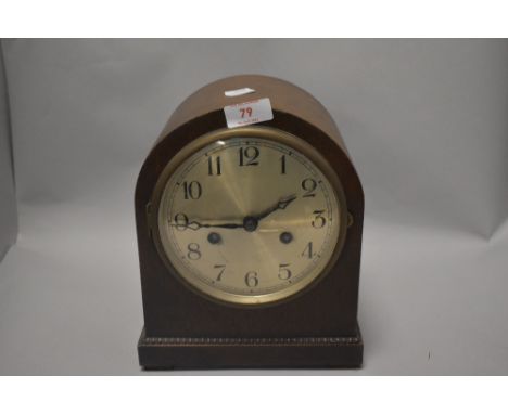 An Edwardian oak cased bracket style mantel clock with chime.