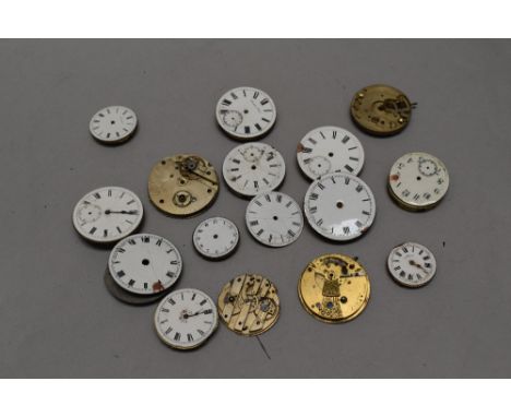 A bag of antique and vintage pocket watch spare and repairs parts.