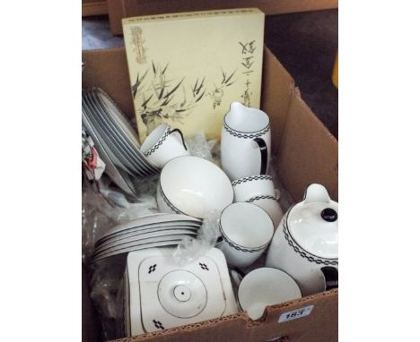 Two large boxes of water advertising jugs, a part coffee set and a blue and white dinner set of Copeland Spode in a wicker ba