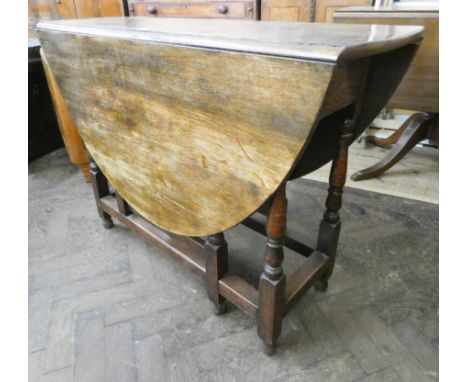 A 3'6 oak drop leaf, gate legged, dining table 