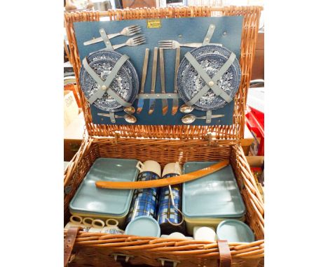 A wicker basket picnic hamper 