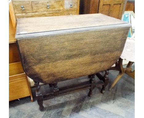 An oak barley twist gate legged dining table  