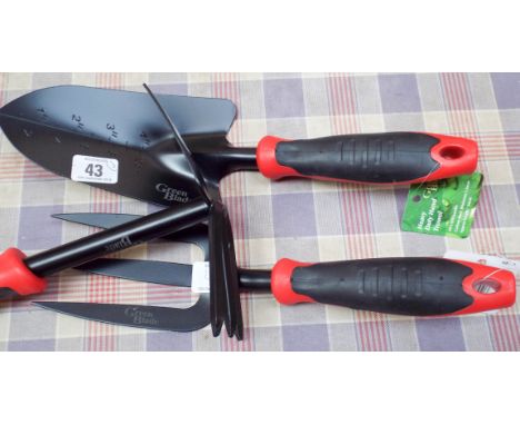 A new garden hand trowel, a new garden fork and a new garden mini hoe