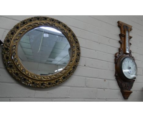 An Edwardian banjo type barometer in walnut case and a circular mirror in gilt frame   Top cornice piece is missing from the 
