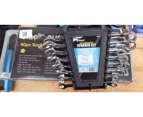 A new 40 piece socket wrench set and a new 8 piece combination spanner set 