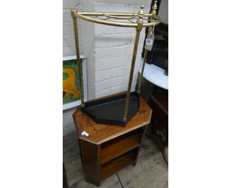 A brass and iron hall stick stand and a small oak book table 