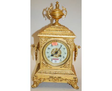 A late 19th century French brass cased mantel clock, having an enamelled dial with Arabic numerals and eight day movement str