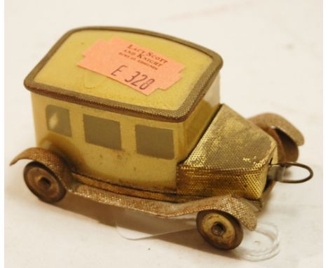 An East German made novelty tape measure in the form of a vintage car
