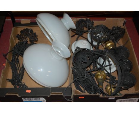 Two Victorian style wrought iron hanging ceiling light fittings, each with opalescent glass shade