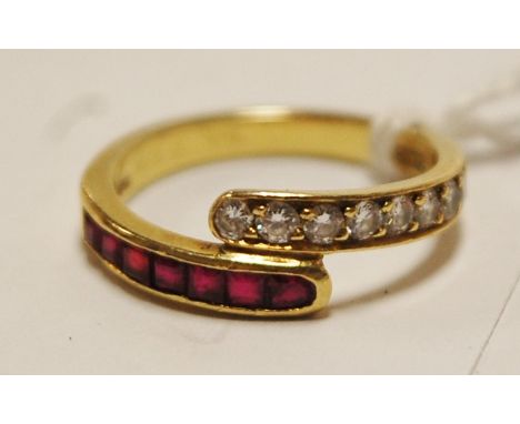 A ladies 18ct gold, ruby and diamond set half eternity ring, arranged as eight channel set small brilliant cut diamonds and s