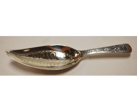 A late Georgian silver caddy spoon, having shaped bowl, bright cut engraved decoration, maker Thomas Wallace II and Jonathan 