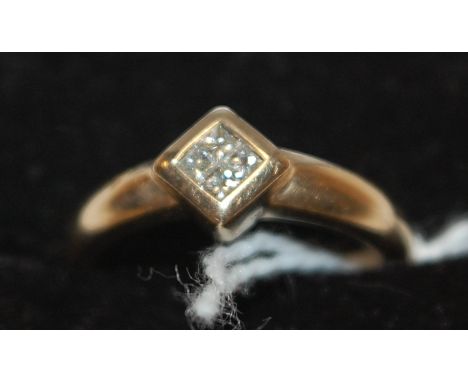 A ladies 9ct gold diamond set dress ring, arranged as four small princess cut diamonds, size M   Condition Report / Extra Inf