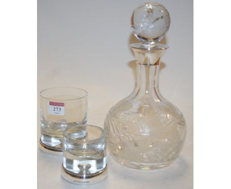 A modern glass decanter and stopper having etched fruiting vine decoration and silver collar together with two similar silver