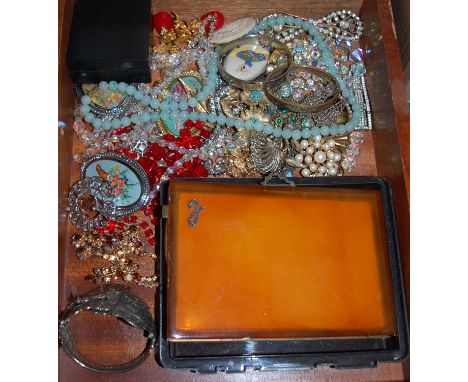 A small collection of assorted costume jewellery to include; Indian white metal bangle, beaded necklaces, paste set brooch et