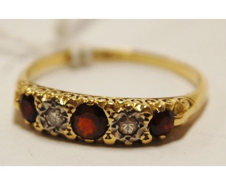 A ladies 18ct gold diamond and garnet set five stone ring, size R