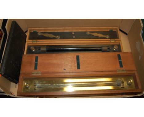 A mid-20th century brass rolling ruler, stamped Stanley, Great Turnstile, Holborn London, in fitted mahogany case; together w
