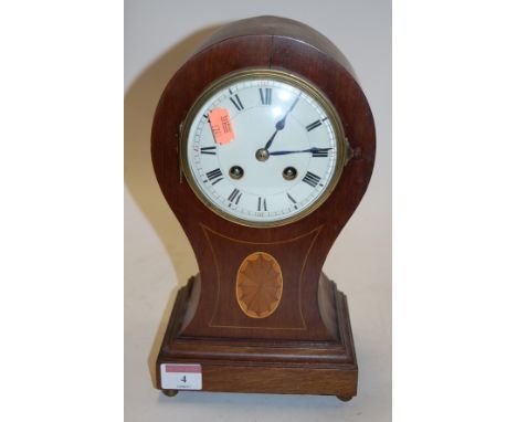 An Edwardian mahogany and satinwood inlaid cased balloon shaped mantel clock, having an enamelled dial with Roman numerals an