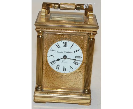 An early 20th century lacquered brass cased carriage clock having a circular enamel dial with Roman numerals, signed Charles 