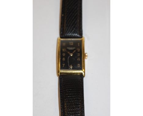 A gents Tiffany & Co gilt metal cased tank watch, having signed black dial, manual wind jewelled movement, dial appears re-fi