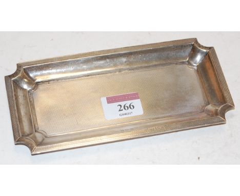 A George V silver dish of shaped rectangular form having all over engine turned decoration