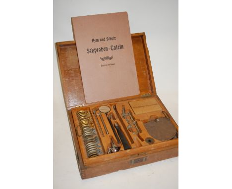 A collection of assorted opticians and doctors equipment to include; mid-20th century oak case containing lenses, tools etc, 