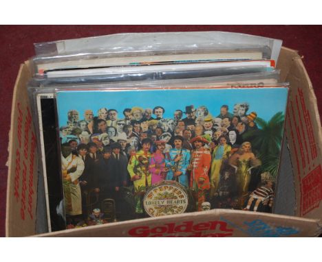 A box of popular LPs to include; The Beatles, The Rolling Stones etc