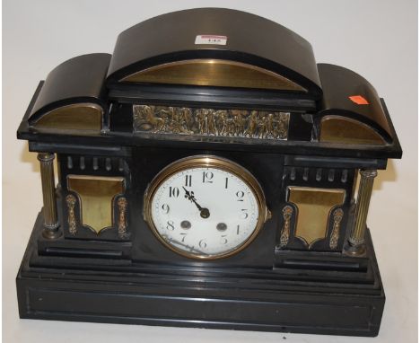 A large late Victorian black slate mantel clock, of architectural form, having silvered dial with Arabic numerals, and eight 