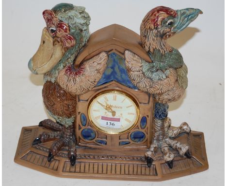 A modern stoneware mantel clock, in the form of two Martin Brothers style grotesque birds, impressed 'Handmade Stoneware Staf