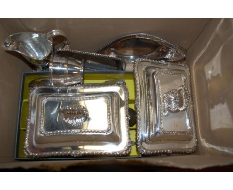 A small collection of assorted silver plated wares to include a pair of entree dishes and covers, helmet shaped cream jug, et