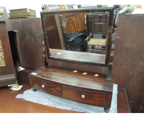 An early 20th century mahogany toilet/swing mirror having turned supports and two drawers under
