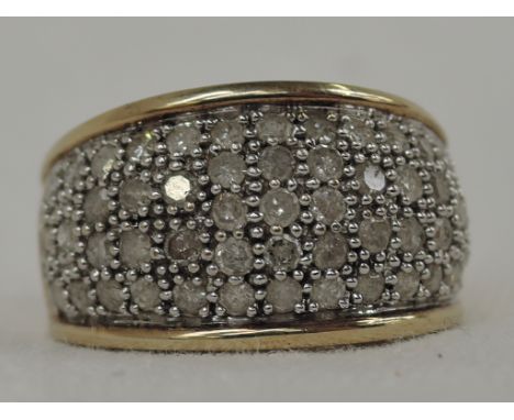 A lady's 9ct gold domed band ring having diamond chip multi row decoration,  approx 1ct on a 9ct gold loop,  size M