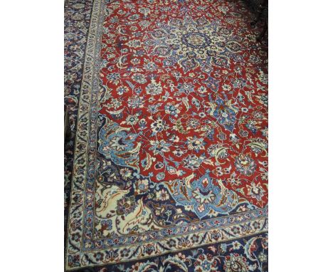 A 20th century carpet square having floral pattern on red ground, 166'x116'