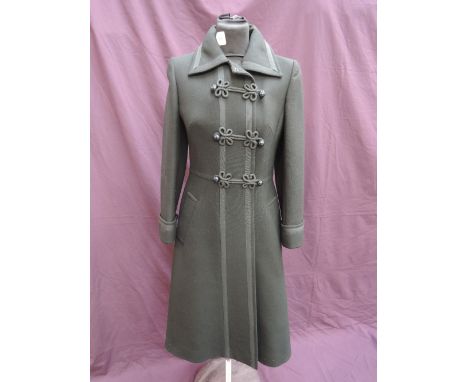 A lady's black wool coat by Mansfield having military style braided decoration and cuffed sleeves
