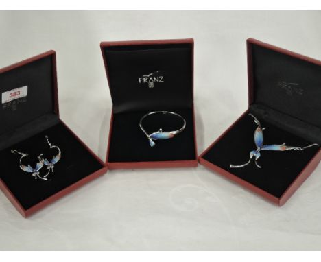 A three piece cased set of Franz costume jewellery in the porcelain butterfly design including bangle, pendant & earrings