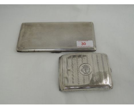 A silver cigarette case of rectangular form having engine turned decoration, Birmingham 1941, E J Trevitt & Sons, and another